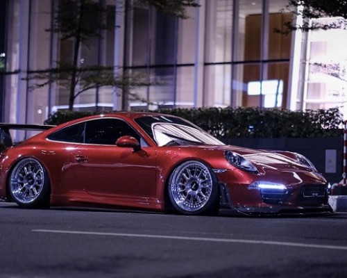 Fashionable posture Porsche 991 slammedenuff speeding at low altitude